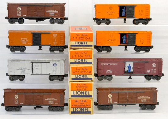 Group of Lionel postwar O gauge automobile cars and operating boxcar