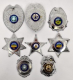 Grouping of eight blank Police / Sheriff badges