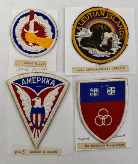 Grouping of four WWII era US Army patches