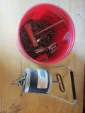 Container of screws and hand magnet