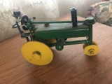 Vintage Metal Farmer on Tractor