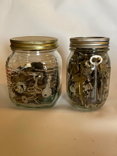 Two Jars Of Assorted Eras Of Keys
