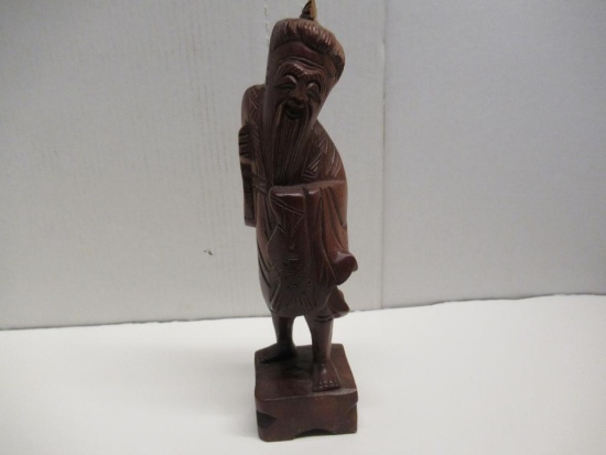 Carved wood statue. 12" tall