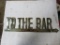 Brass to the bar sign