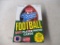 Sealed packs of Fleer Football cards.