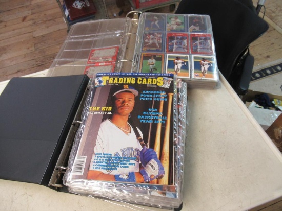 2 binders of sports cards.