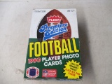 Sealed packs of Fleer Football cards.