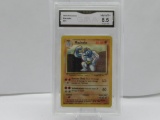 GMA GRADED POKEMON 1999 MACHOKE #34 NM-MT+ 8.5