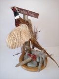 Flying pheasant on Driftwood