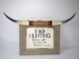 Vintage no hunting sign with bull horn's