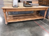 Wooden butcher-block table on caster