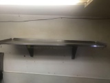 Wall-mounted stainless steel shelf. 48 inches long