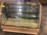 59 inch wide lighted bakery display case, sliding doors in back.