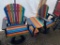 TWO POLY RAINBOW SWIVEL CHAIRS AND END TABLE