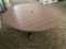 BROWN AND BLACK ROUND POLY TABLE