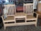 NATURAL WOODEN DOUBLE ADIRONDACK WITH CUP HOLDERS