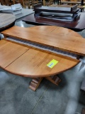 BROWN MAPLE DINING TABLE ONLY 1 LEAF 54IN ROUND