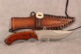 Wood handled knife for NWTF. stamped P.R.C. leather sheath 10.5
