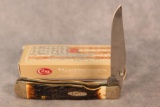 2009 CASE XX TRAPPERLOCK AMBER BONE