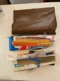 bag full of rulers and other drawing materials