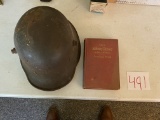 Army helmet and book