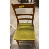 ladder back chair with green cushion