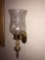 Pair of brass candle sconces with hurricane globe