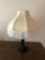 Metal dresser lamp with fringed shade