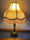 Metal table lamp with fringed shade