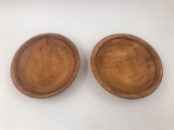 Two small hand carved wooden bowls