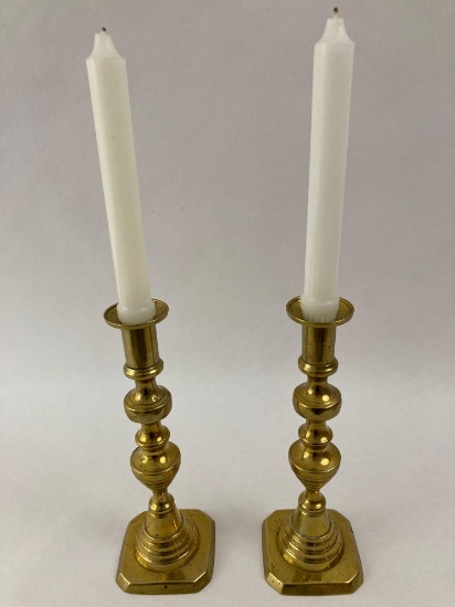 Pair of brass push up candle stick holders