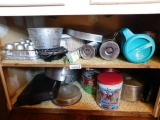 Lot of Items In Cabinet behind Door