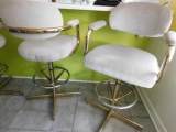 4 Swivel Upholstered Bar Stools.