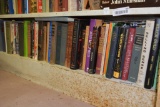 BOOKS BOTTOM SHELF OF METAL BOOKCASE