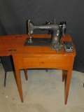 SINGER SEWING MACHINE AND CABINET