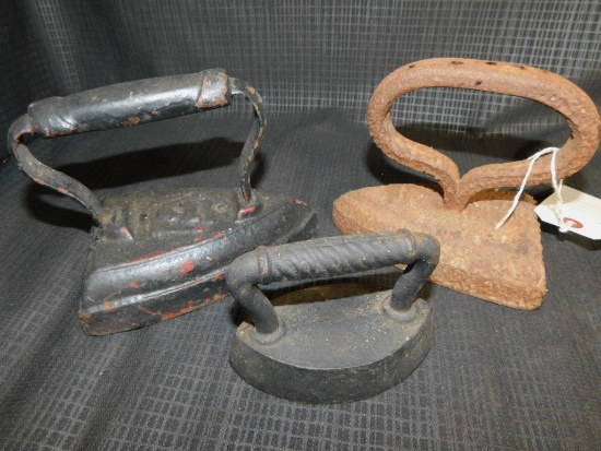 3 CAST IRON SADD IRONS, ONE MARKED NO. 7