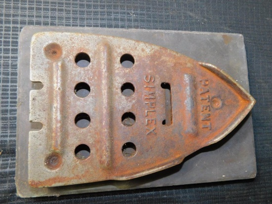 SIMPLEX IRON TRIVET ON STONE