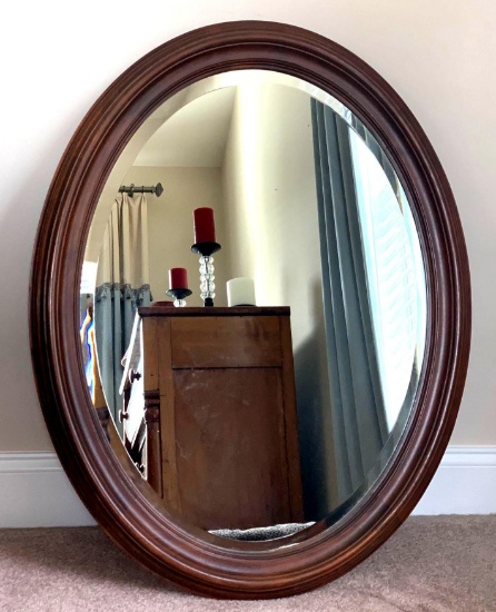 Mahogany frame oval antique mirror