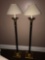 Two Tall antique style wooden base floor lamps.