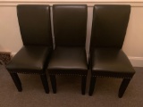 Three executive office style side chairs.