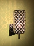 Four bright finish wall sconce lights.