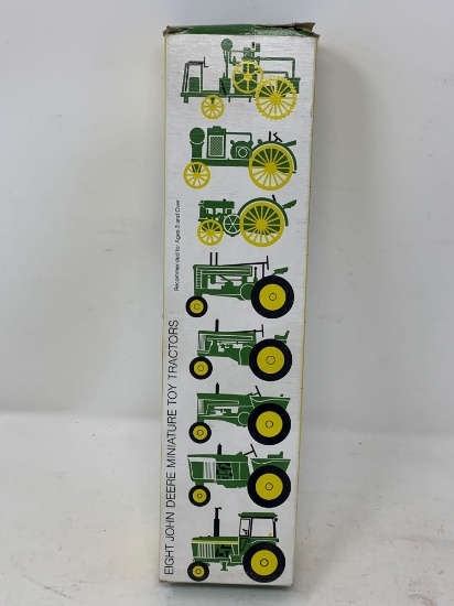 NEW in Box Set of Eight Toy John Deere Tractors.