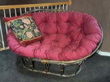 Rattan Love Seat with Pink Cushion and Floral Throw Pillow