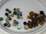 Assorted Damaged Marbles, Steel Shot, and game balls