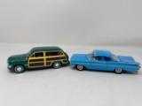 Green 1950 Ford Custom Deluxe Woody and Blue 1959 Chevrolet Impala