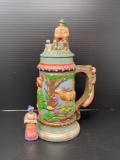 Lidded Stein with Figural Man and Dog on Lid and Woman on Base