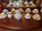 Porcelain Tea Service with Romantic Scene and Gilt floral Decoration