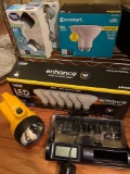 4 Boxes of LED Light Bulbs, Flashlight and Battery Charger