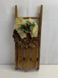 Small Wooden Sled Decorated with Pine Cone Wreath and Bow