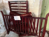 Wooden cherry-stained crib - no mattress